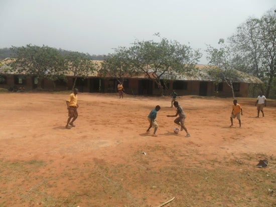 A group of students playing soccer